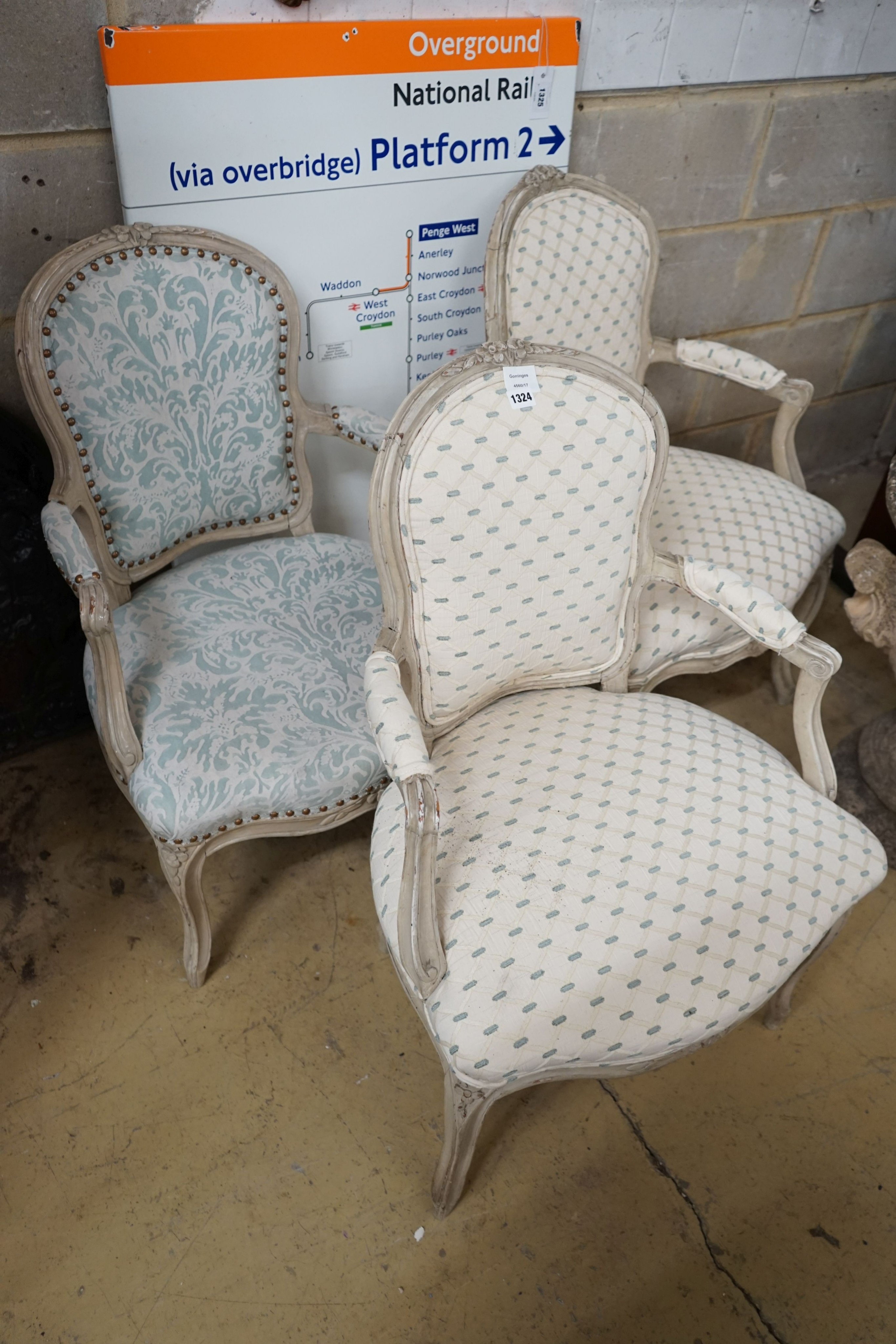 A set of three upholstered French elbow chairs, width 58cm, depth 48cm, height 85cm